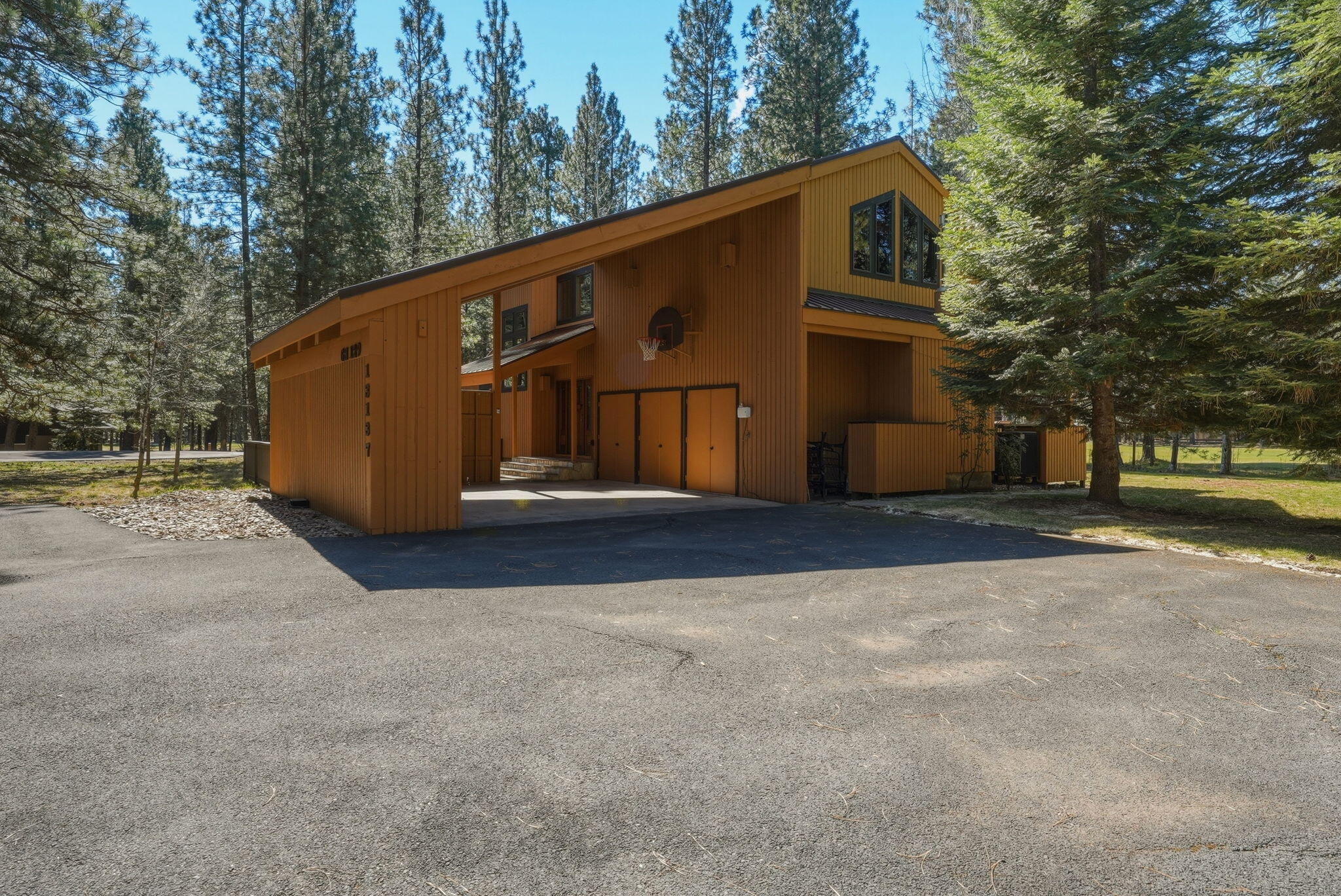13137 Hawks Beard, Unit GH 129 Black Butte Ranch, OR 97759 - Photo 51 of 57 a front view of a house with a yard
