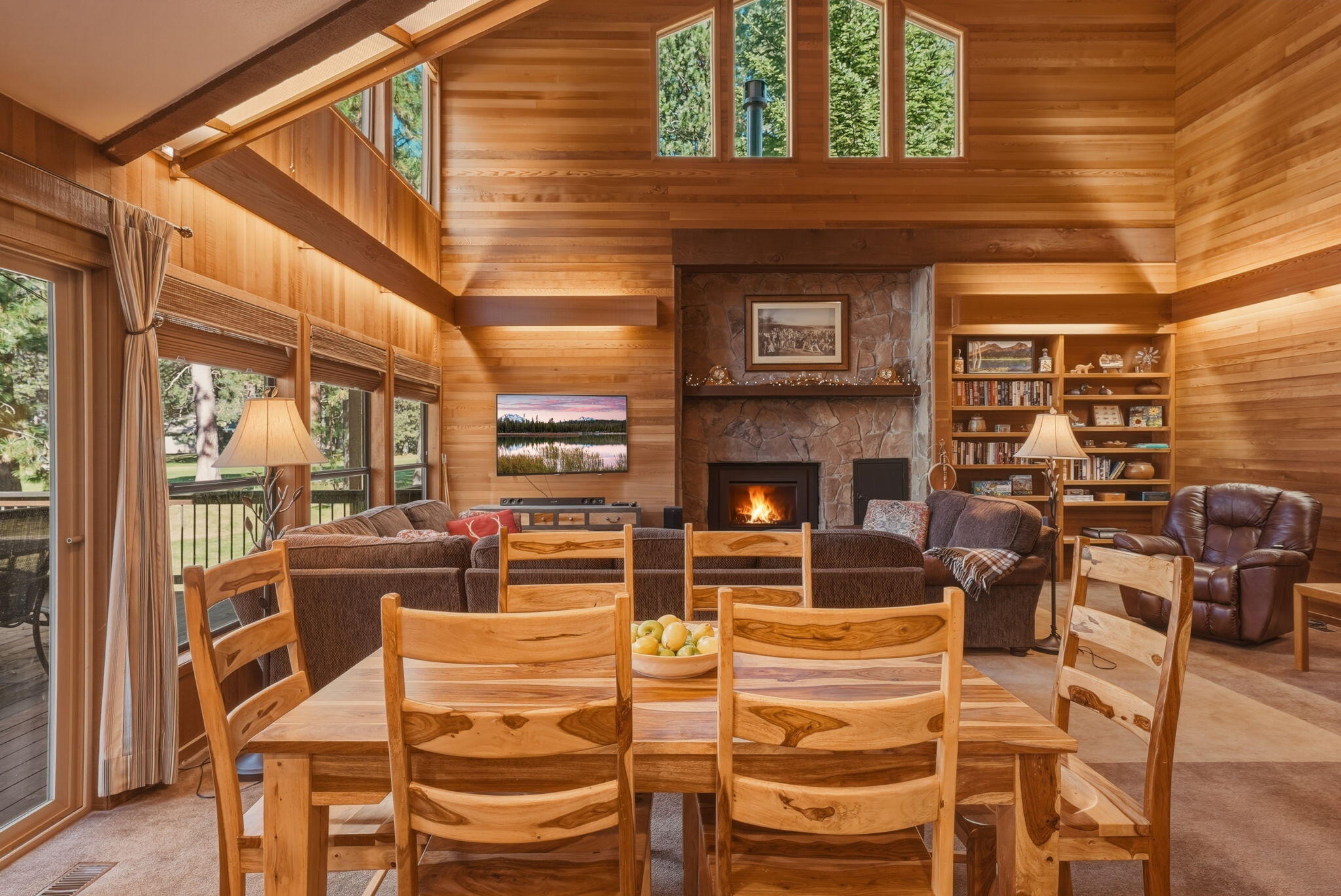 13137 Hawks Beard, Unit GH 129 Black Butte Ranch, OR 97759 - Photo 5 of 57 a view of a patio with dining table and chairs with wooden floor