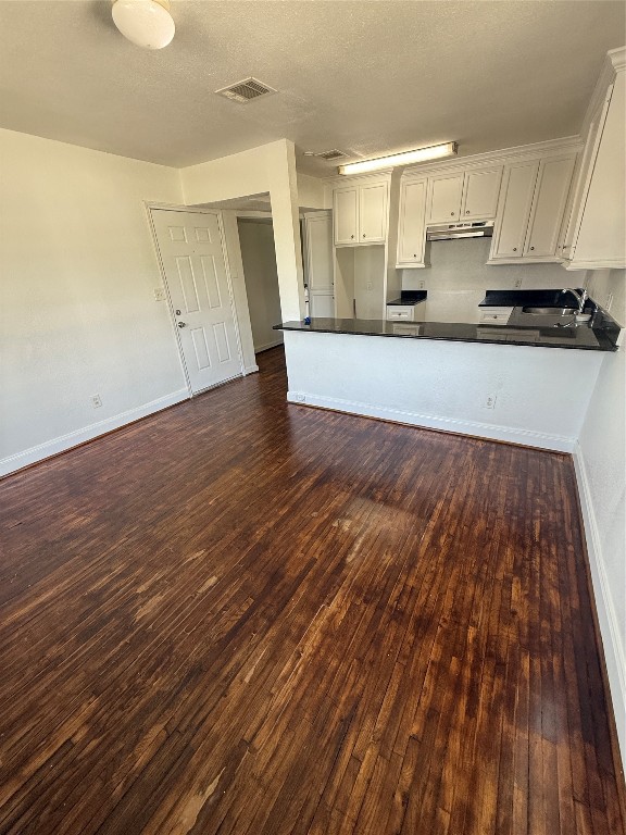 3002 Market Street, Unit 4 Houston, TX 77020 - Photo 3 of 13 a view of a kitchen with wooden floor and electronic appliances
