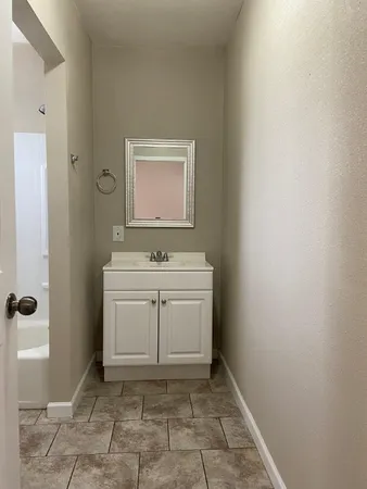 a room with washing machine and sink