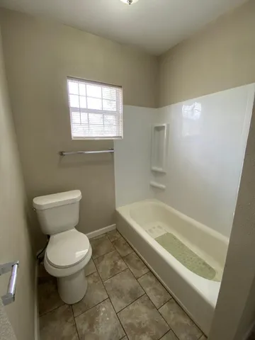 a bathroom with a toilet sink and bathtub
