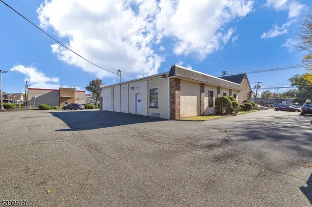 an aerial view of residential house with parking