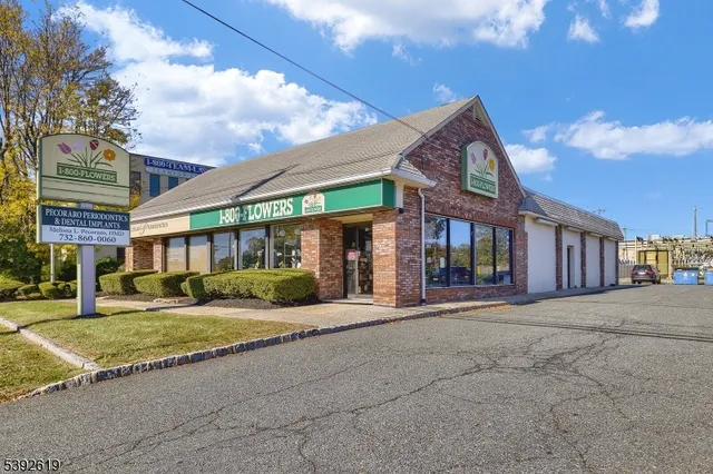 a view of a building with a yard