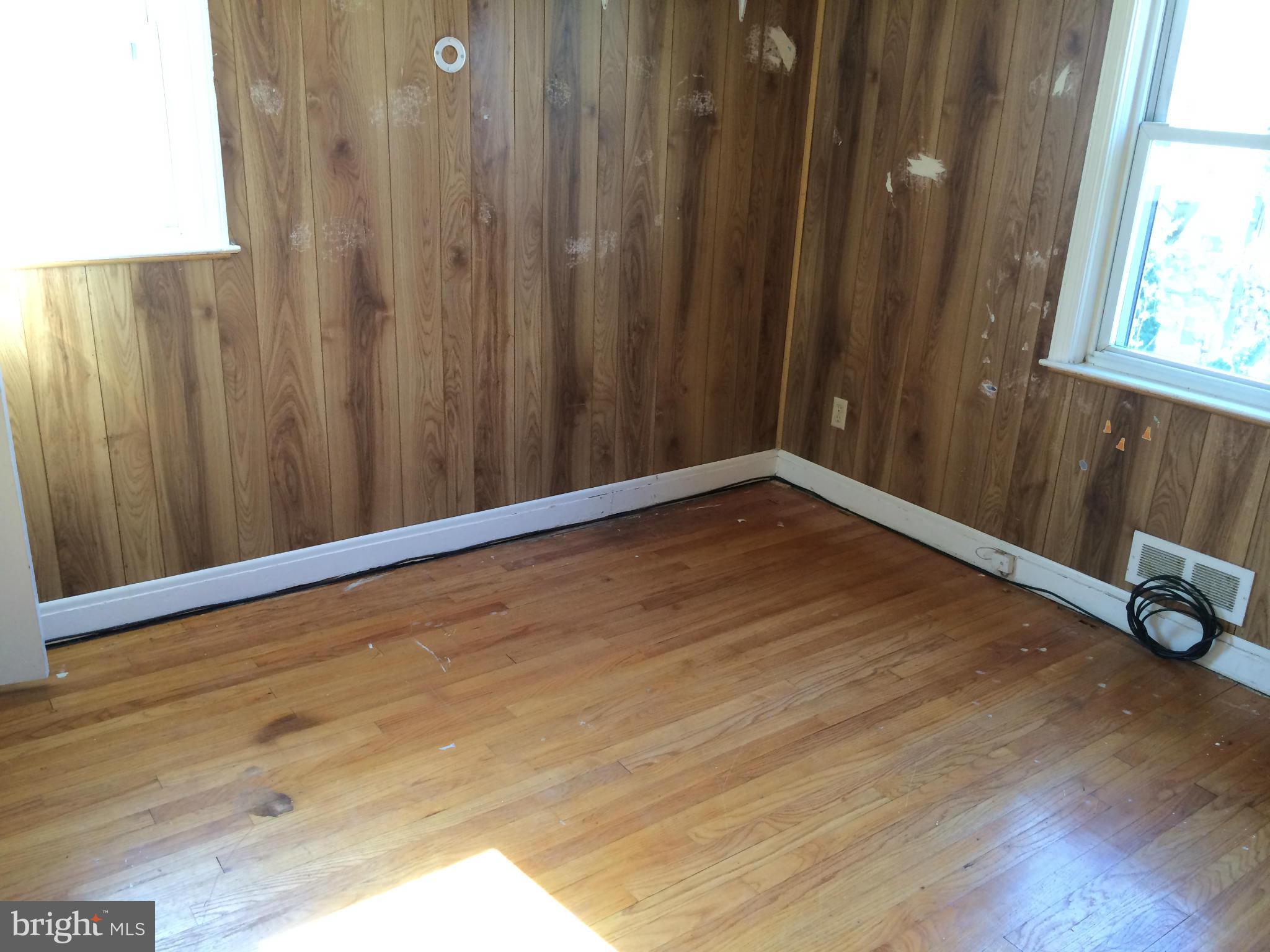 4425 Eldone Road Baltimore, MD 21229 - Photo 8 of 11 a view of an empty room with wooden floor