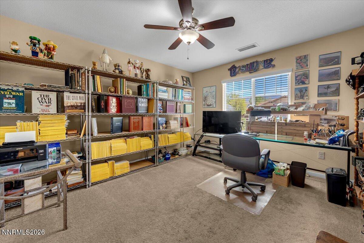 104 Bethpage Road Dayton, NV 89403 - Photo 19 of 65 a reading room with furniture and a flat screen tv
