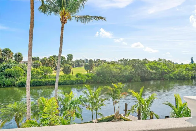 a view of a swimming pool with an outdoor space and seating area