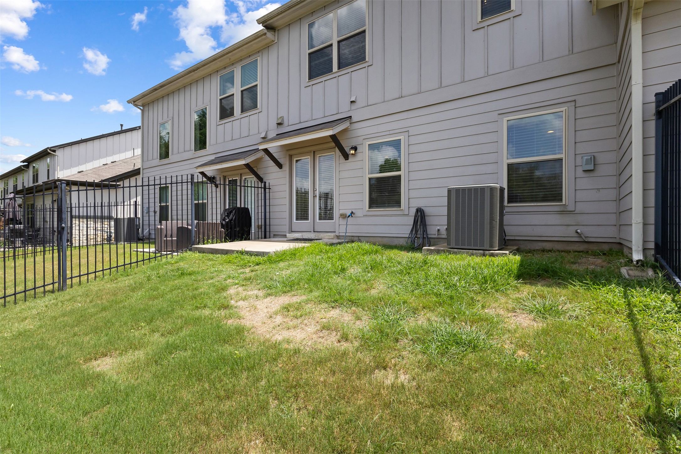 1510 Catalan Road, Unit 602 Austin, TX 78748 - Photo 32 of 36 Back of house featuring board and batten siding