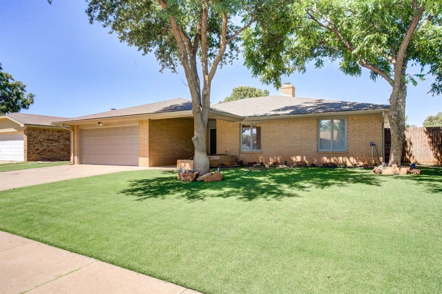 5304 90th Street Lubbock, TX 79424 - Photo 2 of 39 a front view of house with yard and green space