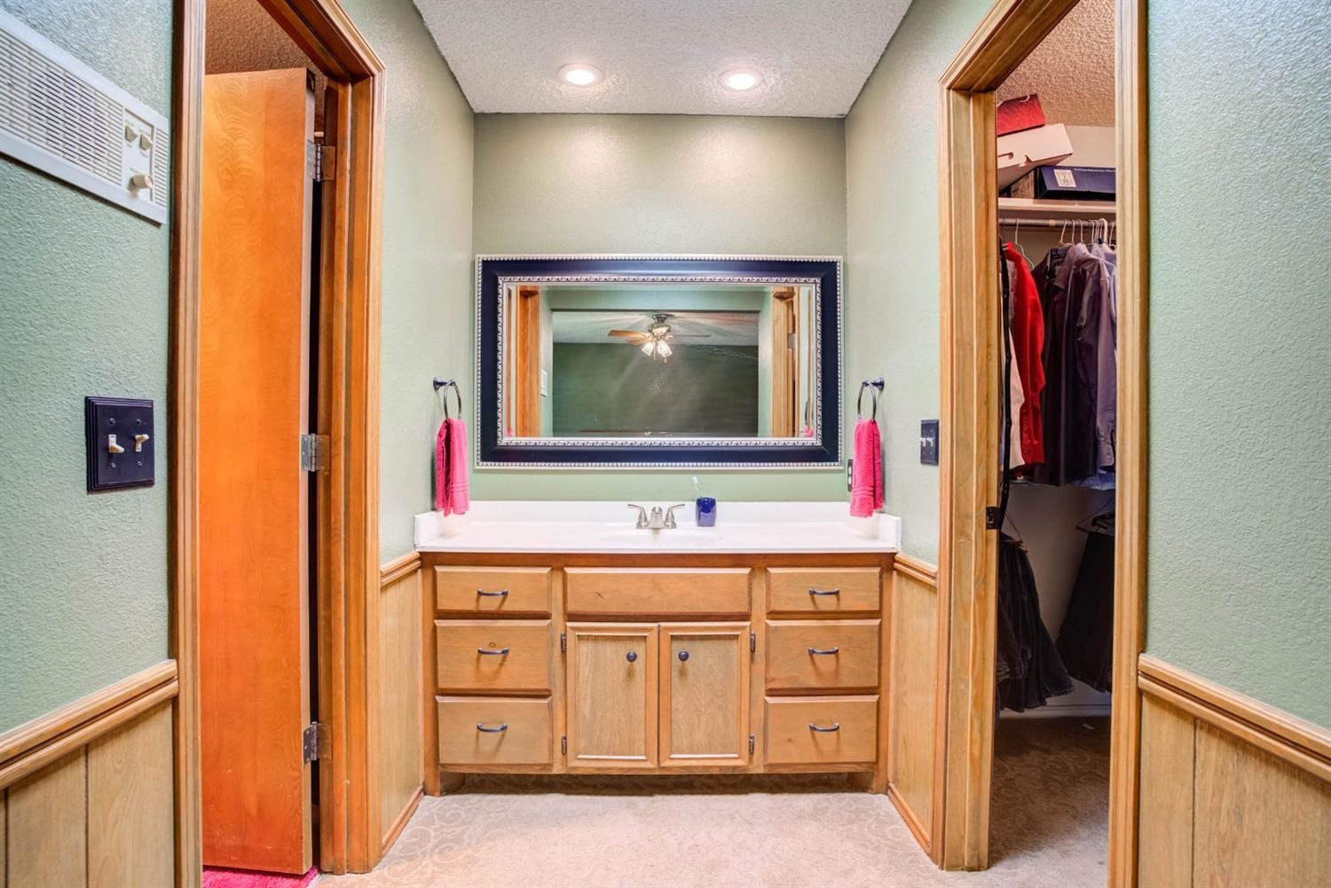 5304 90th Street Lubbock, TX 79424 - Photo 21 of 39 a bathroom with a sink and a mirror