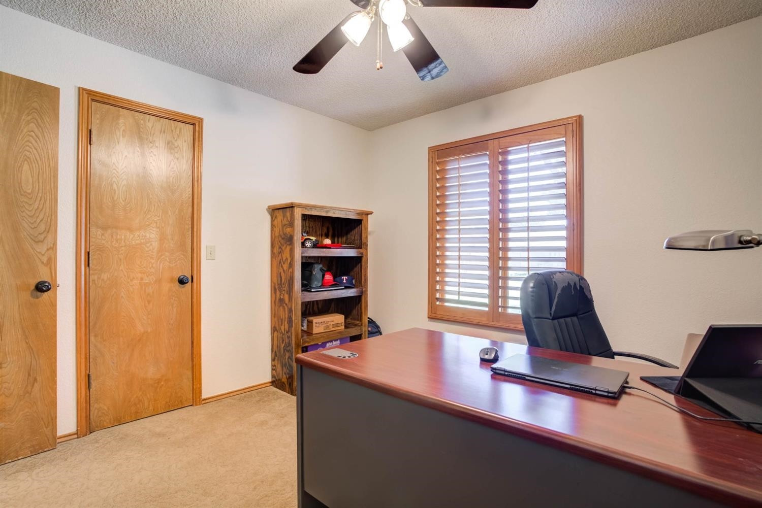 5304 90th Street Lubbock, TX 79424 - Photo 28 of 39 a view of a workspace with furniture and a window