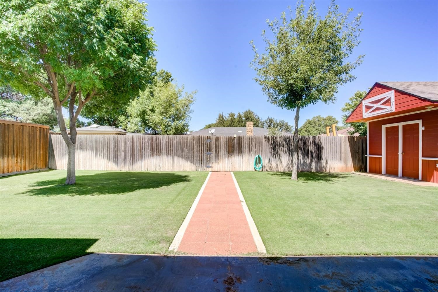 5304 90th Street Lubbock, TX 79424 - Photo 34 of 39 a view of house with backyard and a garden