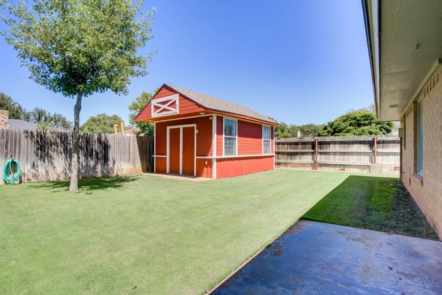 5304 90th Street Lubbock, TX 79424 - Photo 38 of 39 a front view of a house with a yard