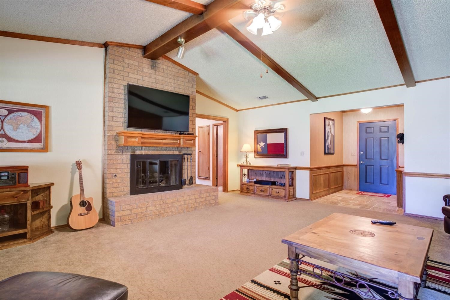 5304 90th Street Lubbock, TX 79424 - Photo 7 of 39 a living room with furniture and a fireplace
