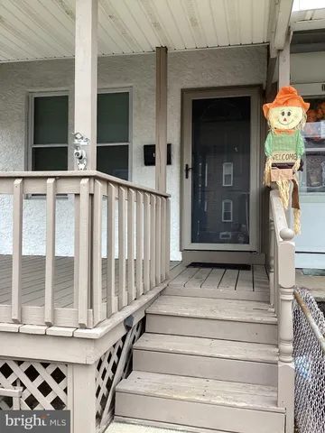 a front view of a house with large windows
