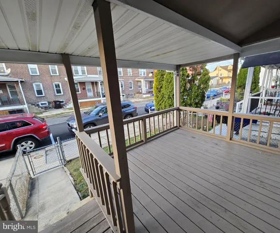 a view of a porch with wooden floor