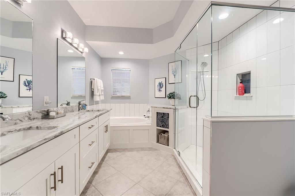 22971 Rosedale Drive, Unit 101 Estero, FL 34135 - Photo 17 of 43 RE-MODELED BATHROOM OFFERS ADDITIONAL STORAGE SPACE