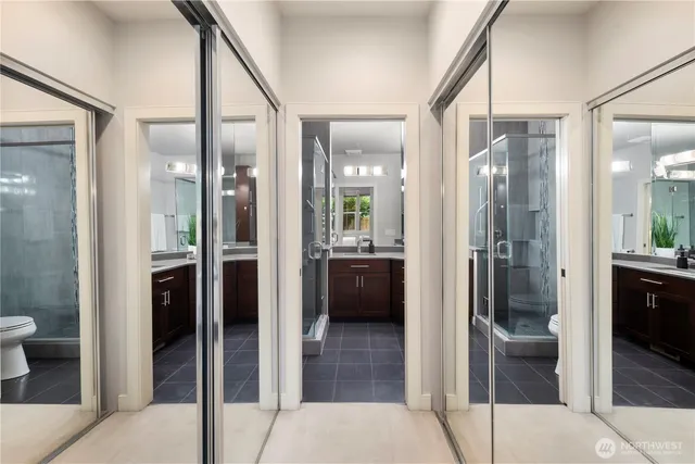 a bathroom with a shower and a sink