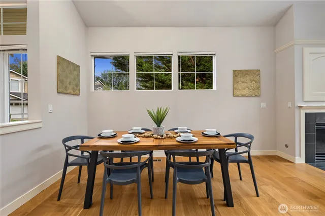 a view of a dining room with furniture and window