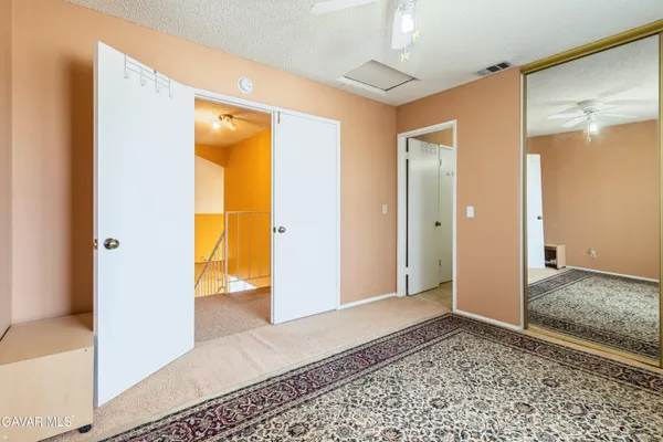 a view of a bathroom with a glass door shower and a sink