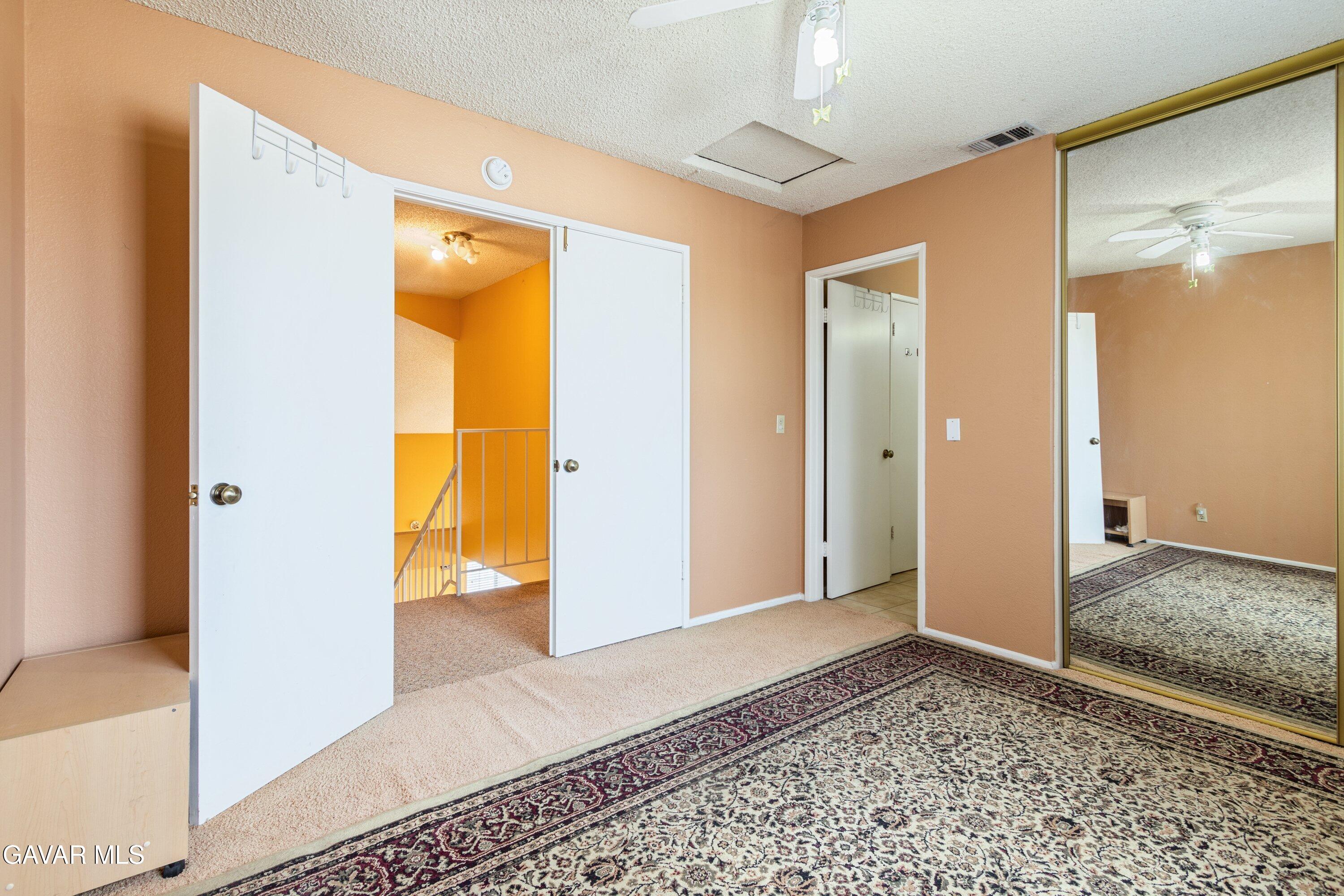 4625 Avenue R6 E Palmdale Ca East Palmdale, CA 93552 - Photo 19 of 25 a view of a bathroom with a glass door shower and a sink