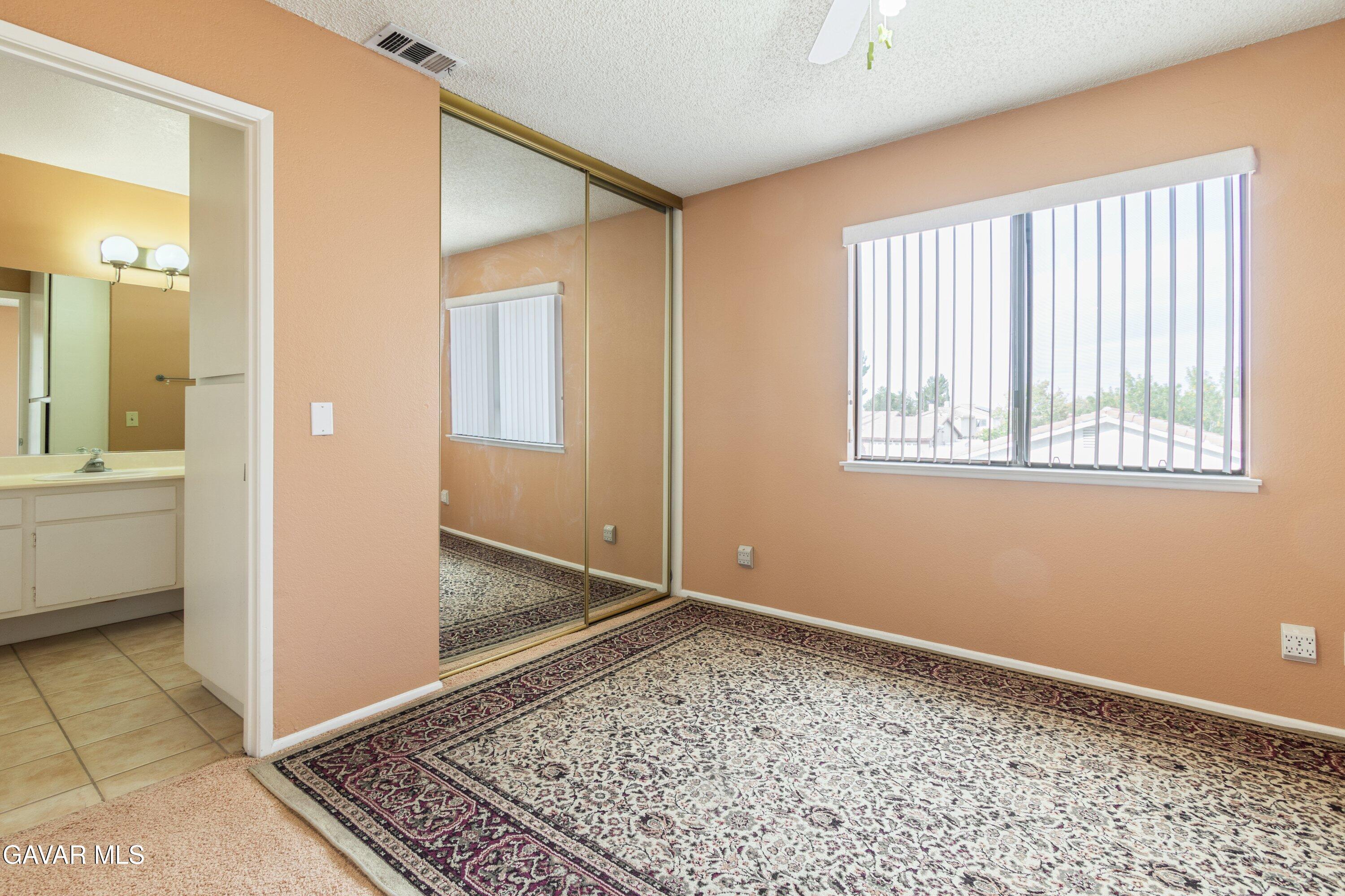4625 Avenue R6 E Palmdale Ca East Palmdale, CA 93552 - Photo 22 of 25 a view of an empty room with a window