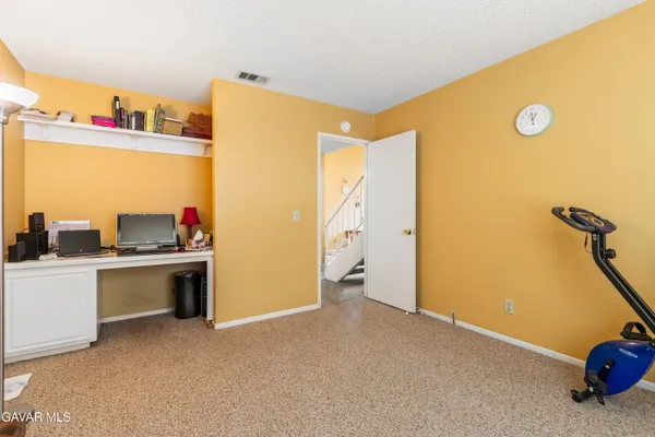 a view of a storage & utility room with a sink
