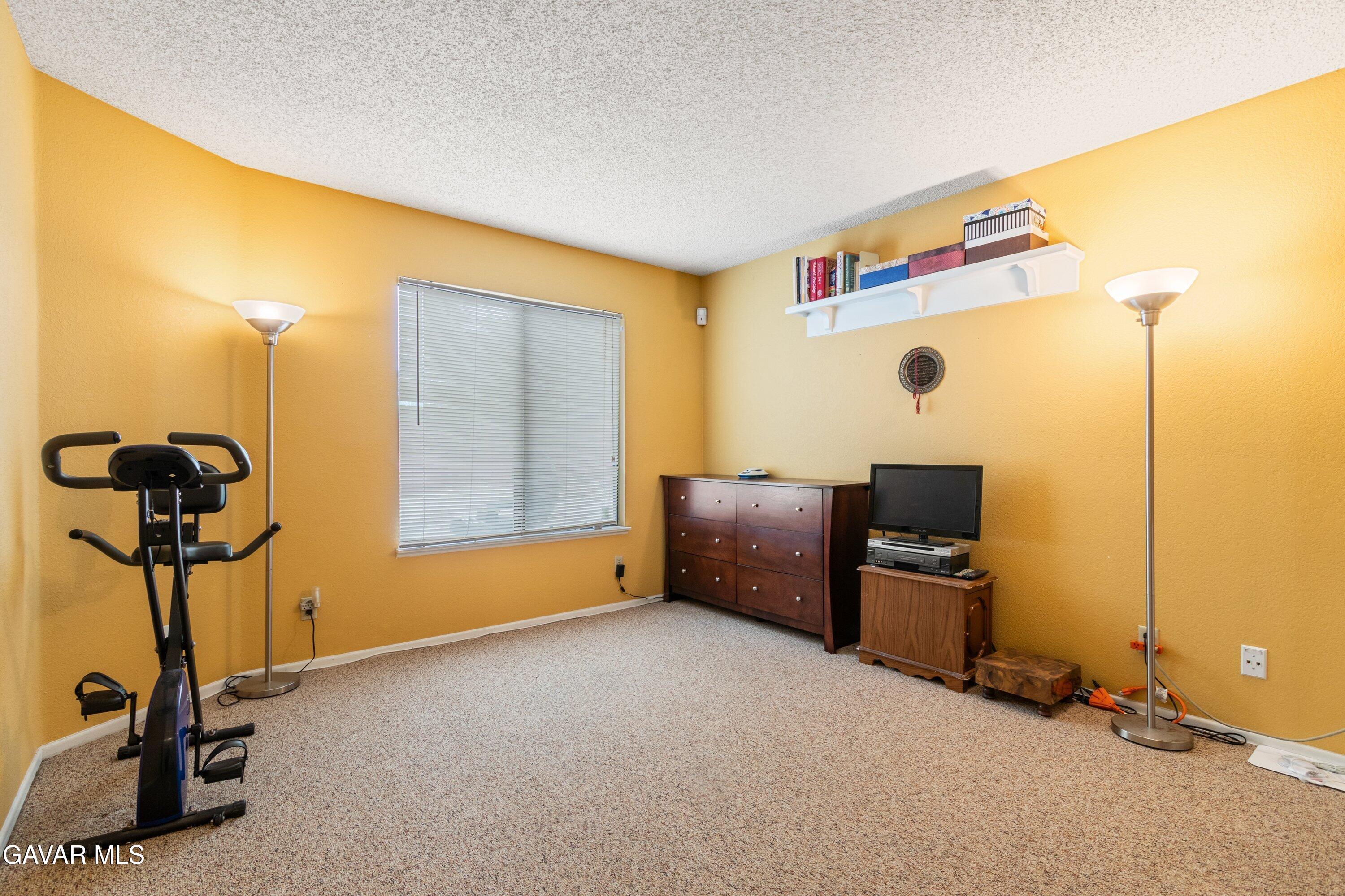 4625 Avenue R6 E Palmdale Ca East Palmdale, CA 93552 - Photo 10 of 25 a view of a room with gym equipment