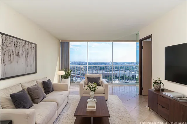 a living room with furniture and a flat screen tv