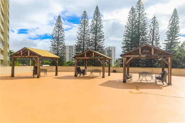 a view of a park with large tree