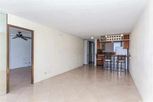 an empty room with furniture and a table