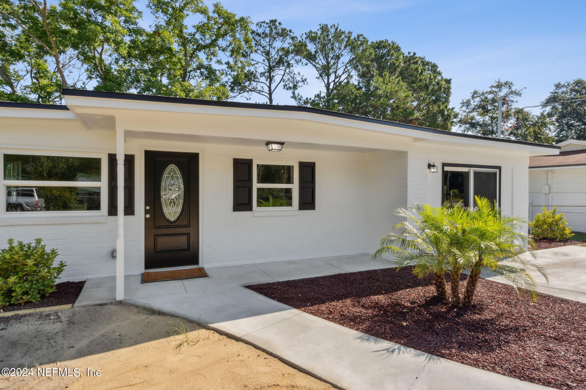 9411 Orme Road Jacksonville, FL 32220 - Photo 1 of 33 a front view of a house with garden