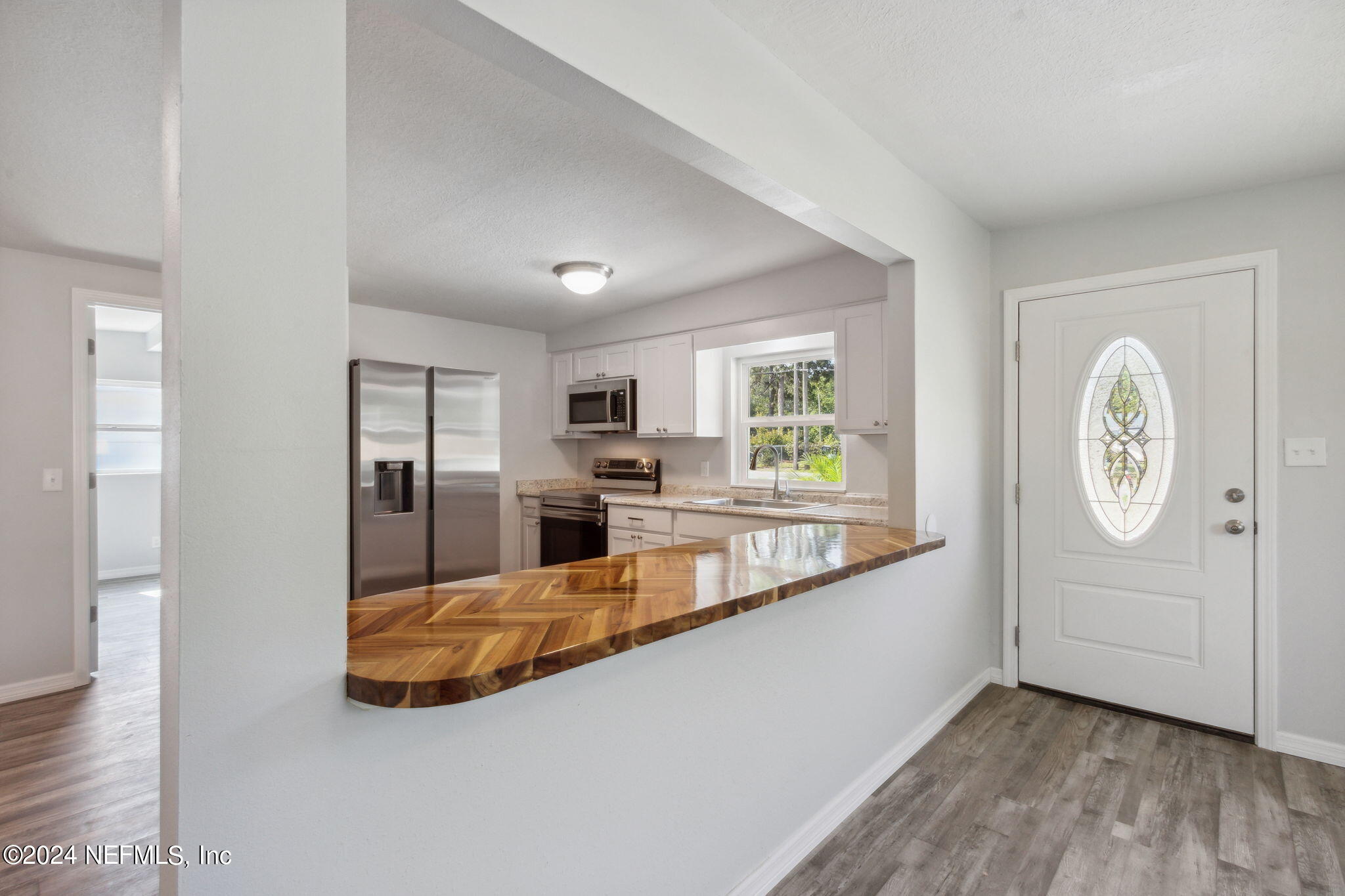 9411 Orme Road Jacksonville, FL 32220 - Photo 11 of 33 a view of a living room and window