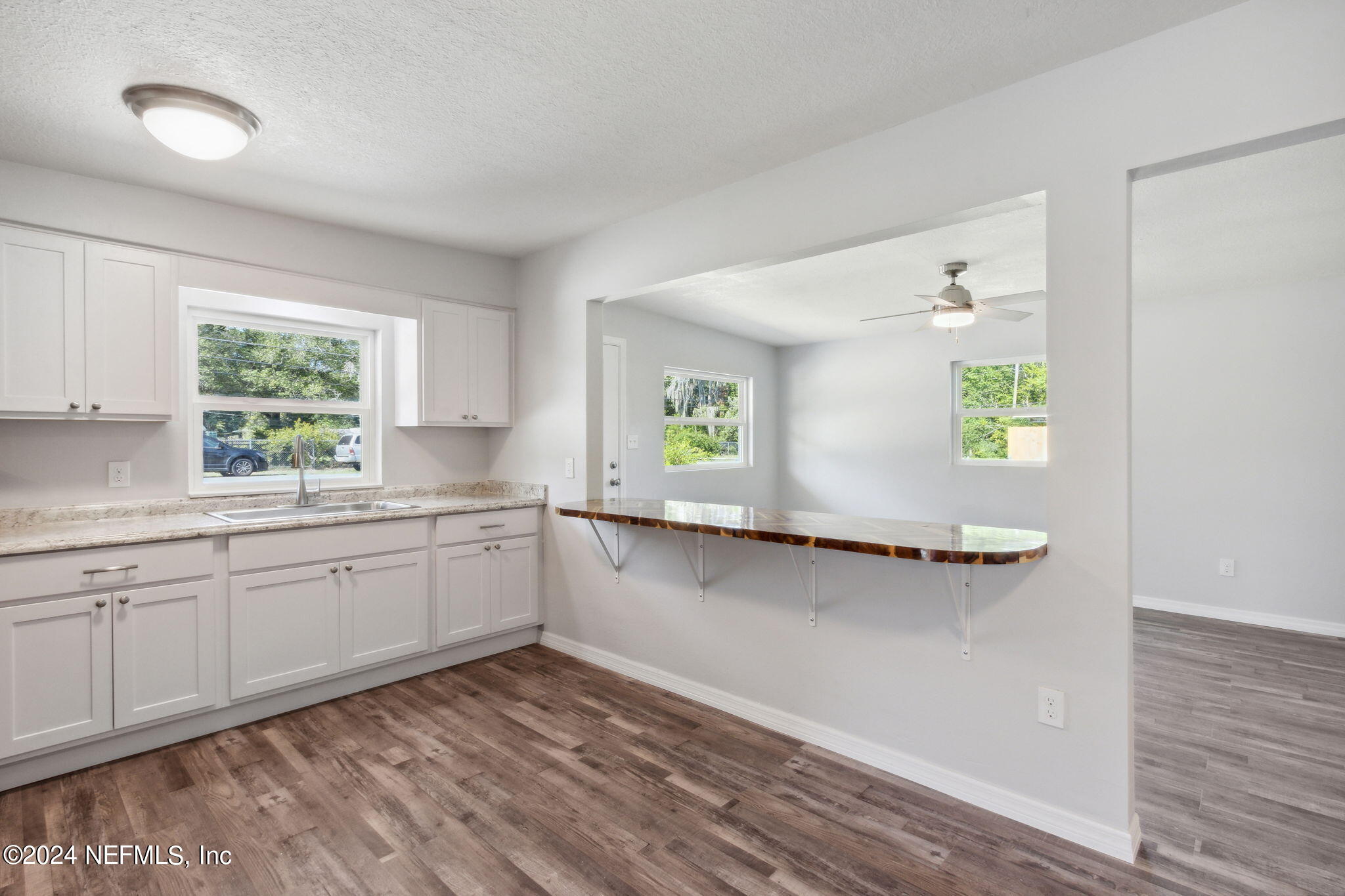 9411 Orme Road Jacksonville, FL 32220 - Photo 13 of 33 a kitchen with a sink and a window