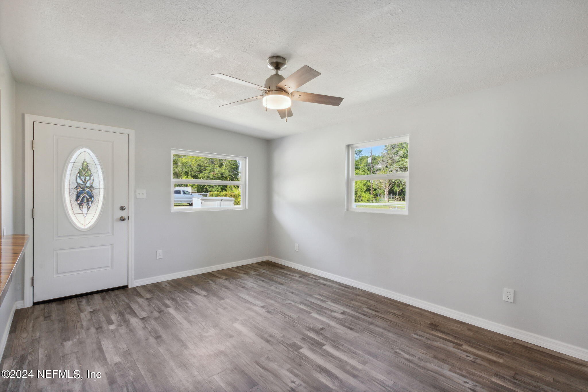 9411 Orme Road Jacksonville, FL 32220 - Photo 10 of 33 a view of an empty room with window and closet area