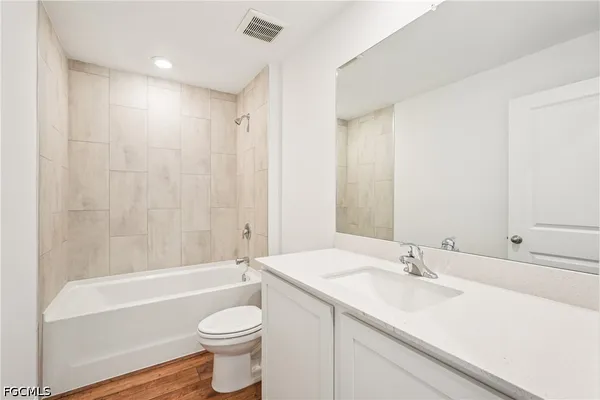 a bathroom with a sink a toilet and a bathtub