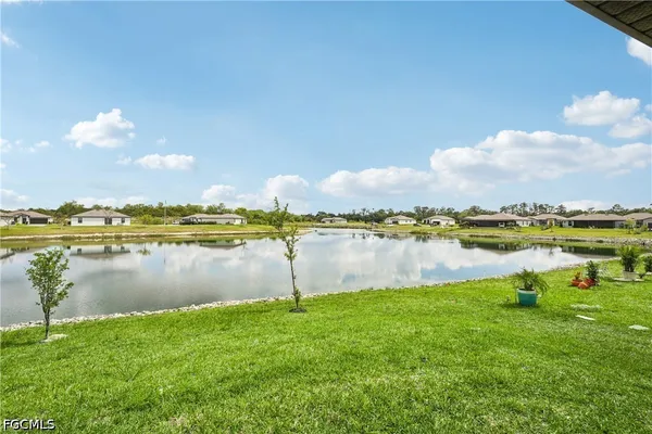 a view of a lake with houses in the back