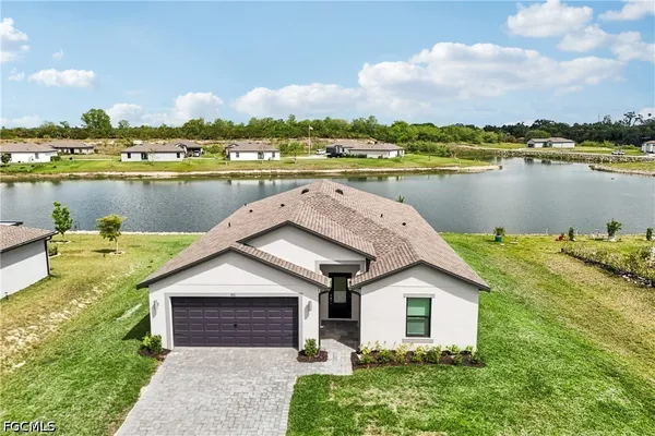 a front view of a house with a lake view