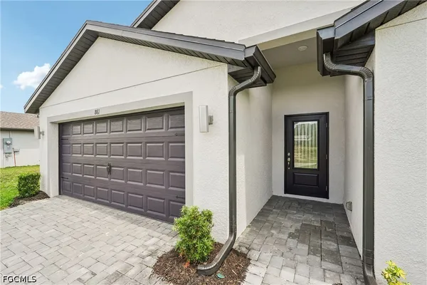 a view of front door and a window