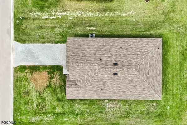 an aerial view of a house with a garden
