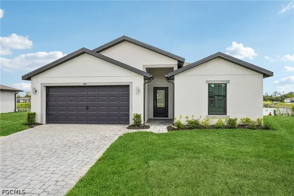a front view of a house with a yard