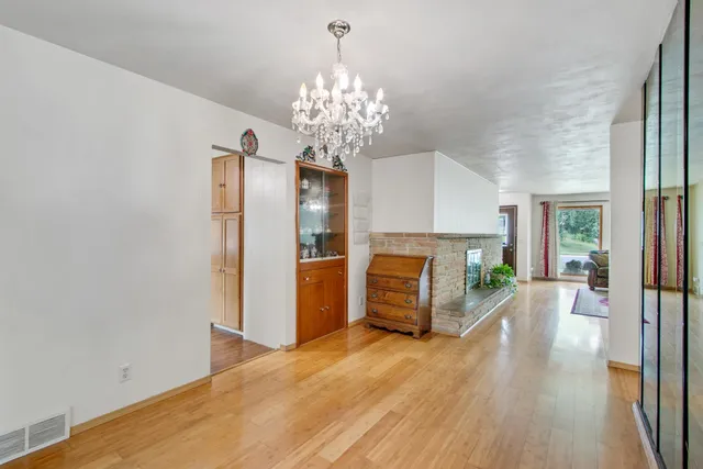 a living room with furniture fireplace and a table
