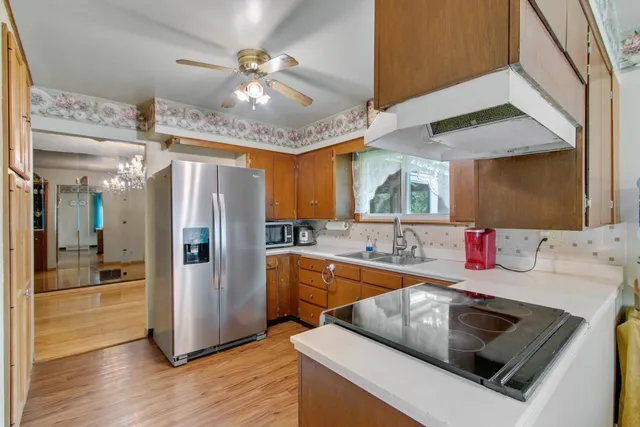 a kitchen that has a table and chairs in it