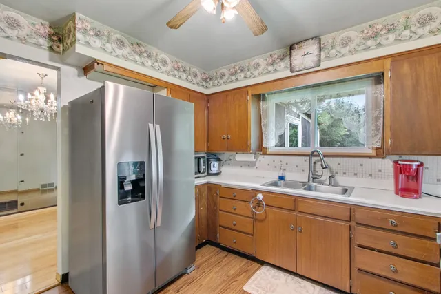 a kitchen with stainless steel appliances granite countertop a stove and a refrigerator