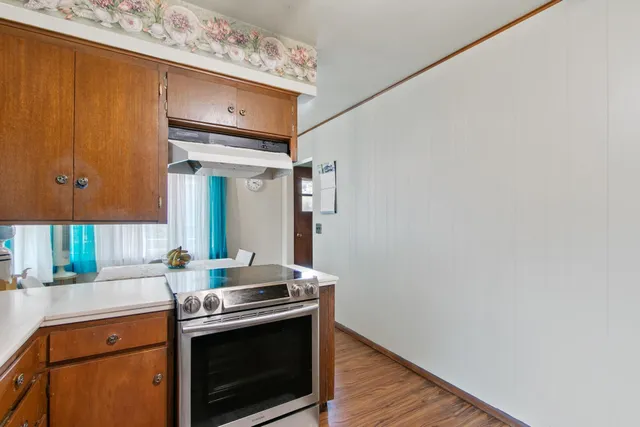 a bedroom with a bed and a large mirror