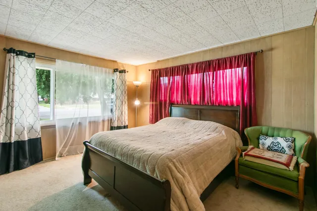 a view of a livingroom with an empty space and a fireplace