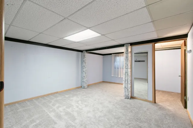 a bathroom with a shower and a sink