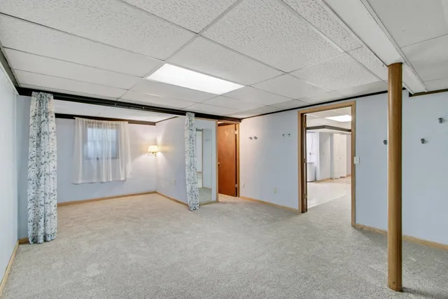 a view of backyard with green space and staircase