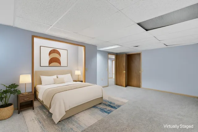 a view of a house with a yard and sitting area