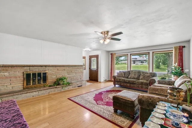 a dining room with furniture and window
