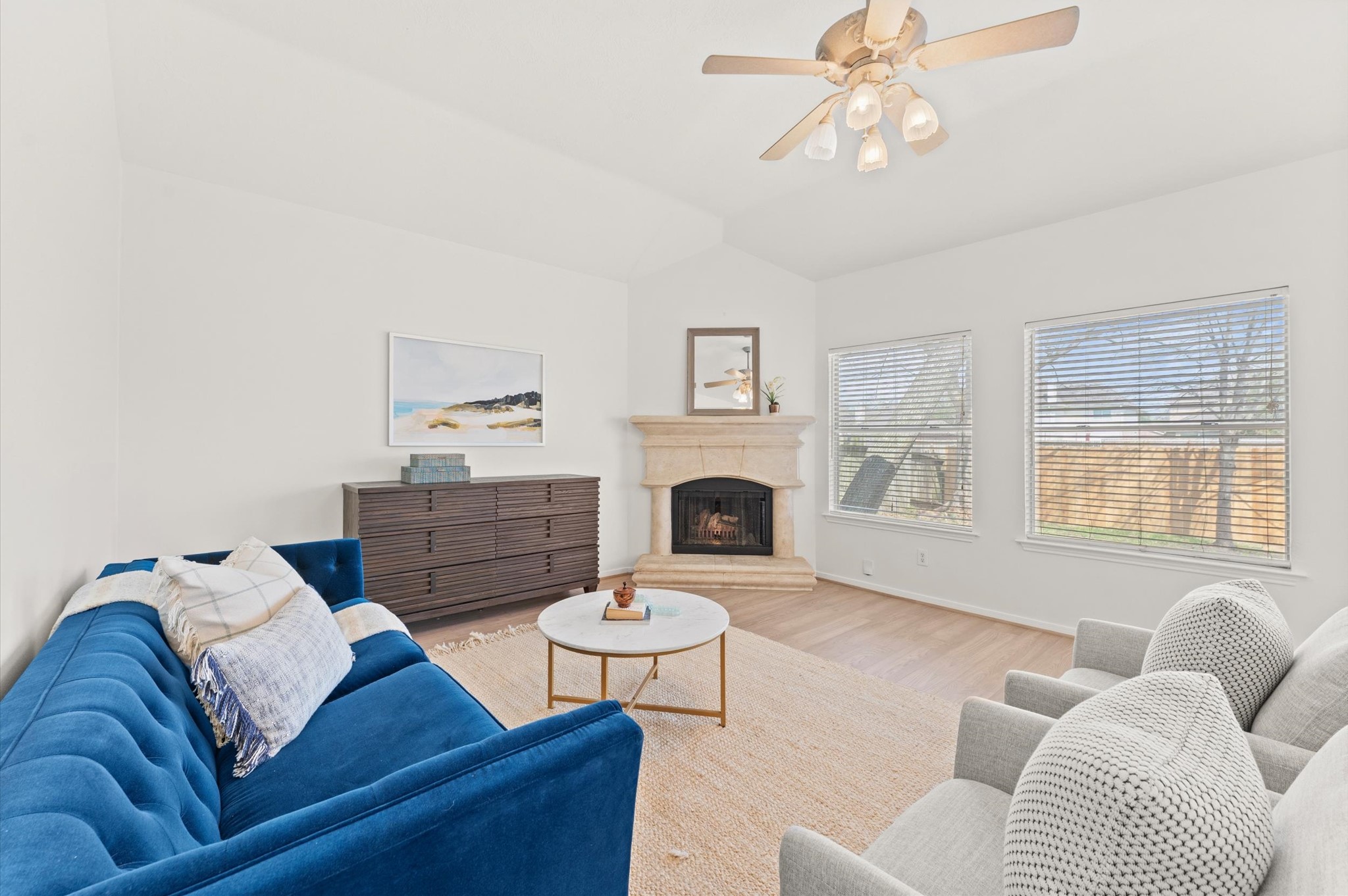 From high ceilings to gorgeous vinyl plank flooring, there is so much to enjoy in this inviting family room! Large windows allow filtered natural light and a terrific backyard view.